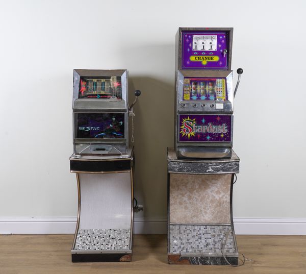 A 'STARDUST' AND A 'PENNY STAR' ONE ARMED BANDIT MACHINES WITH STANDS (4)