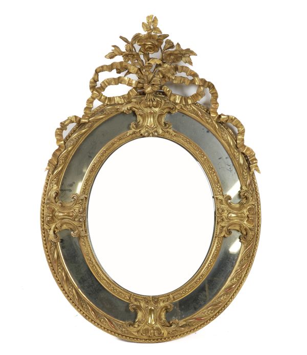 A VICTORIAN GILT FRAMED OVAL MARGINAL WALL MIRROR