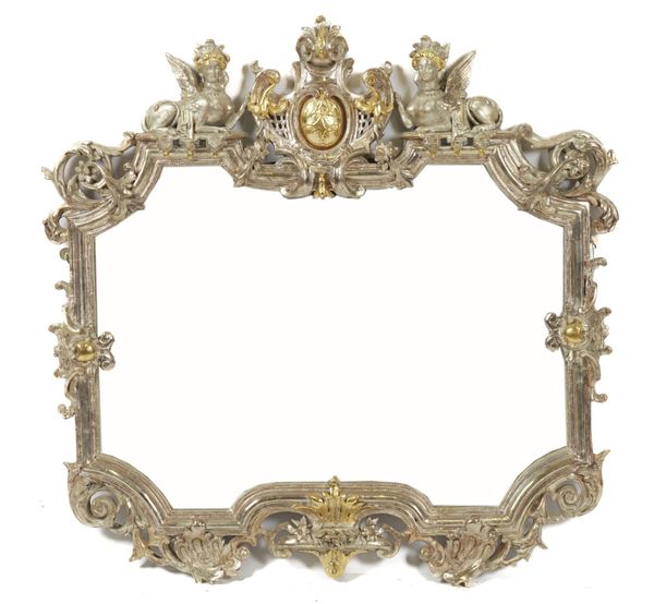 A 19TH CENTURY SILVER AND PARCEL GILT FRAMED SHAPED MIRROR