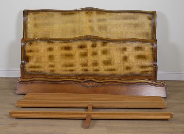 A FRENCH WALNUT AND CANE KING SIZE BED