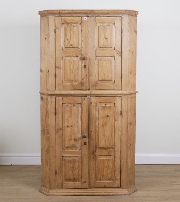 AN EARLY 20TH CENTURY PINE FLOOR STANDING CORNER CABINET