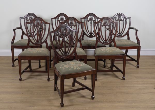 A SET OF EIGHT GEORGE III STYLE MAHOGANY SHIELD BACK DINING CHAIRS (8)