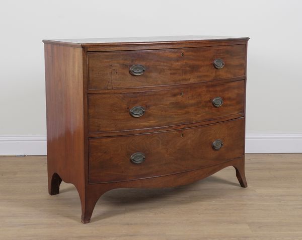 A GEORGE III MAHOGANY BOWFRONT THREE DRAWER CHEST