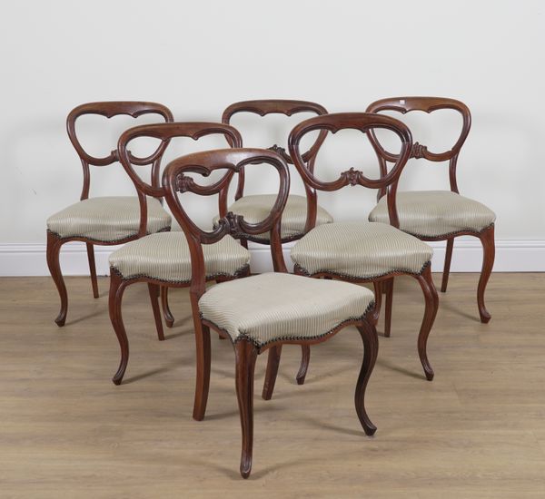 A SET OF SIX VICTORIAN ROSEWOOD BALLOON BACK DINING CHAIRS (6)