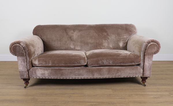 A TAUPE VELVET UPHOLSTERED SOFA