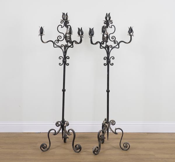 A PAIR OF BLACK PAINTED WROUGHT IRON FOUR BRANCH FLOOR STANDING CANDLEABRA (2)