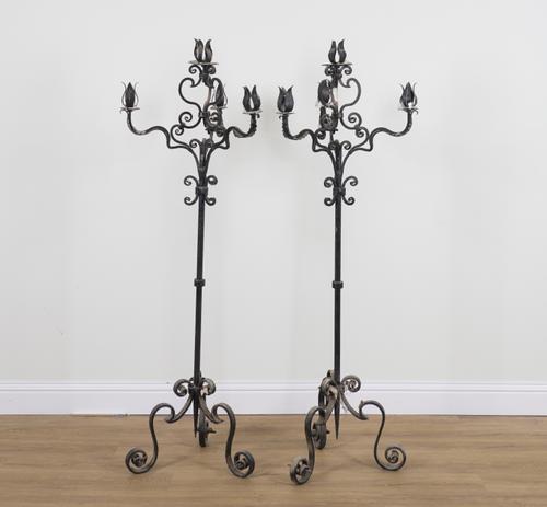 A PAIR OF BLACK PAINTED WROUGHT IRON FOUR BRANCH FLOOR STANDING CANDLEABRA (2)