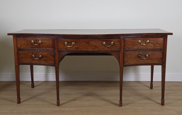 A LARGE GEORGE III MAHOGANY SERPENTINE FRONTED SIDEBOARD