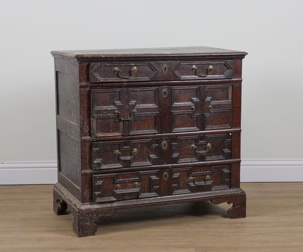 A CHARLES II OAK CHEST WITH FOUR LONG GEOMETRIC MOULDED DRAWERS