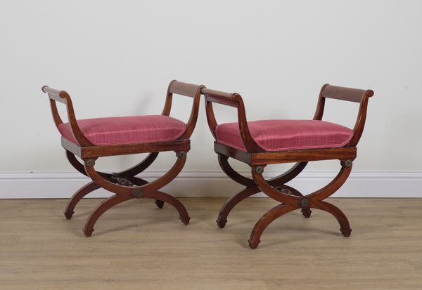 A PAIR OF REGENCY STYLE MAHOGANY X-FRAME FOOTSTOOLS (2)