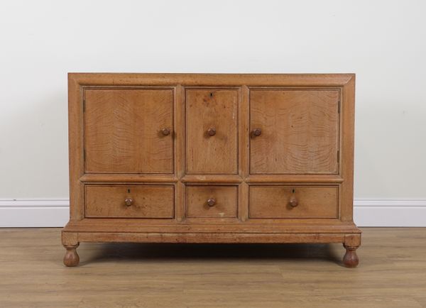 HEALS; A LIMED OAK SIDE CABINET