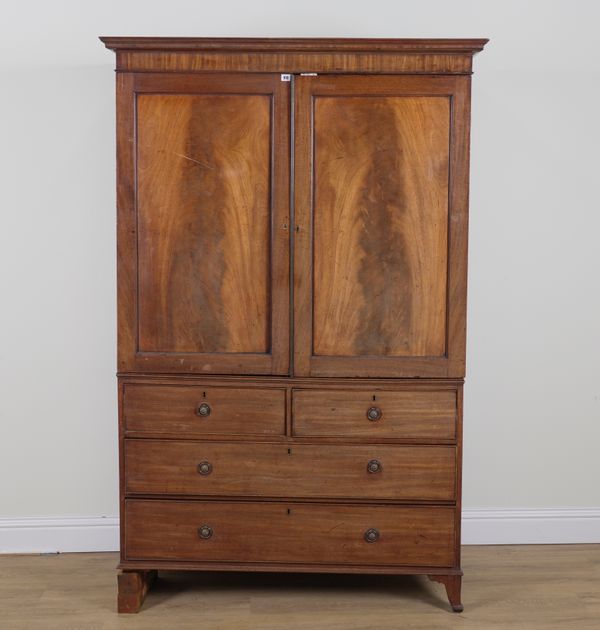 A LATE GEORGE III MAHOGANY LINEN PRESS