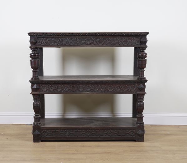 A 17TH CENTURY CARVED OAK THREE TIER BUFFET