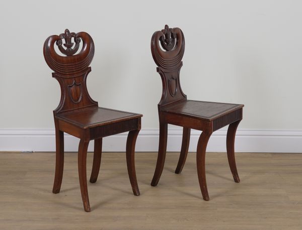 A PAIR OF REGENCY MAHOGANY HALL CHAIRS (2)