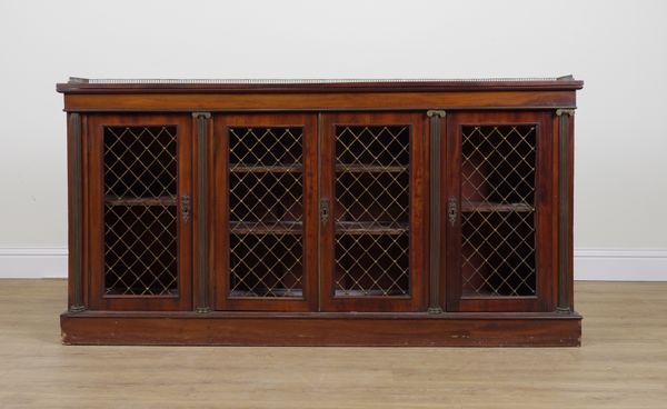 A REGENCY MAHOGANY FLOOR STANDING FOUR DOOR BOOKCASE