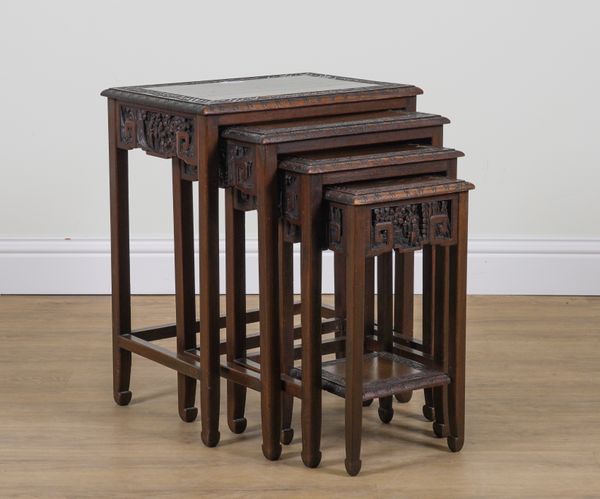 A CHINESE EXPORT CARVED HARDWOOD NEST OF FOUR TABLES (4)