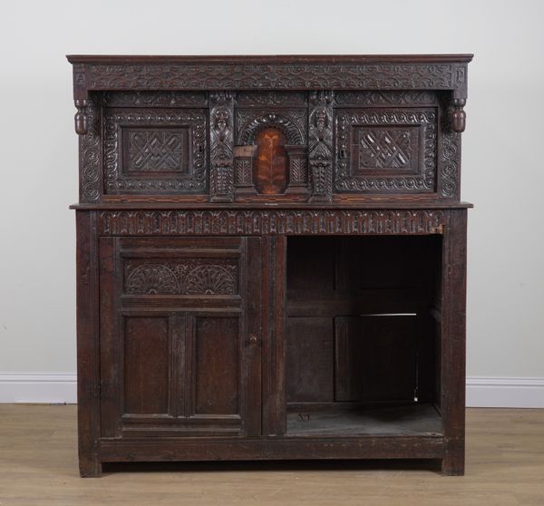 A 17TH CENTURY CARVED AND MARQUETRY INLAID OAK COURT CUPBOARD