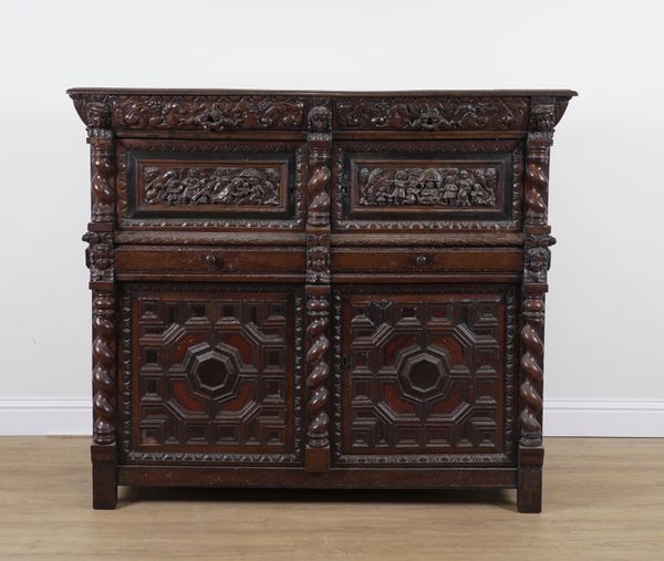 A 17TH CENTURY EXTENSIVELY CARVED OAK SIDE CABINET