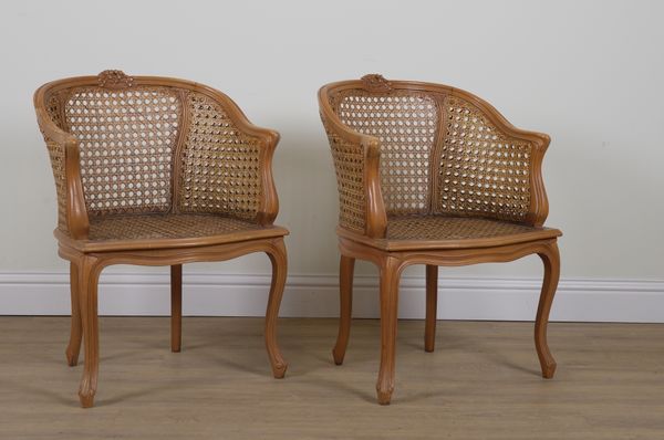 A PAIR OF FRENCH STAINED BEECH CANEWORK TUB CHAIRS (2)