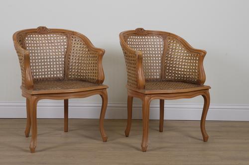 A PAIR OF FRENCH STAINED BEECH CANEWORK TUB CHAIRS (2)
