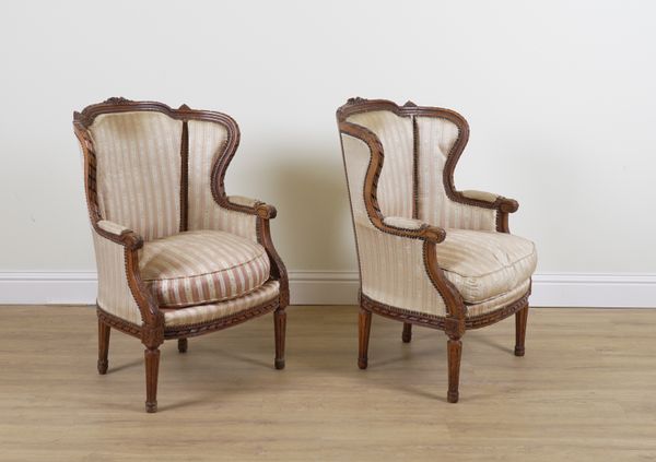 A PAIR OF LOUIS XVI STYLE CARVED BEECH FRAMED TUB BACK ARMCHAIRS (2)