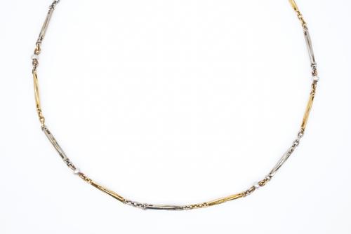A TWO COLOUR GOLD AND SEED PEARL DRESS ALBERT CHAIN