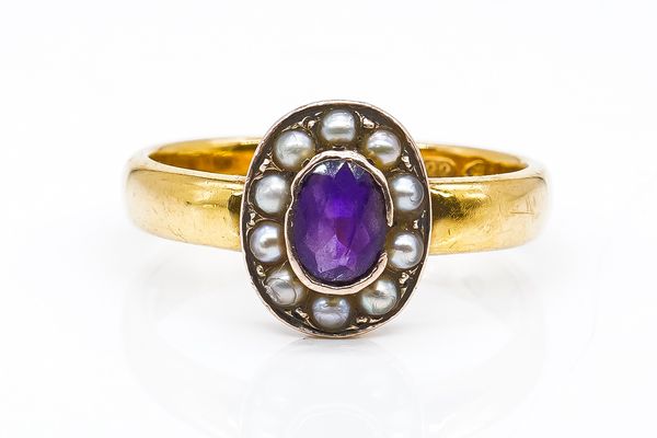 A GOLD AMETHYST AND HALF PEARL OVAL CLUSTER RING