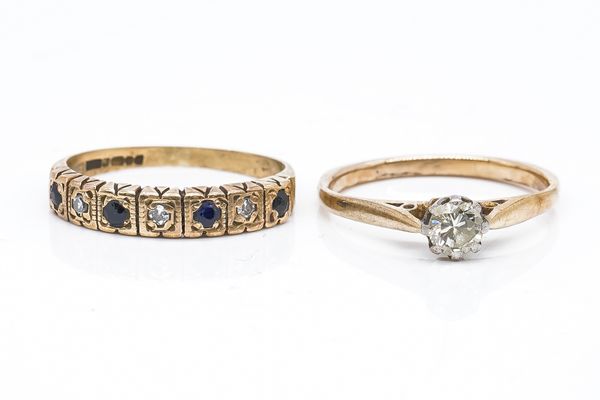 A DIAMOND SOLITAIRE RING AND A GEMSET BAND (2)