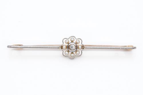 A GOLD, DIAMOND AND SEED PEARL CLUSTER BAR BROOCH