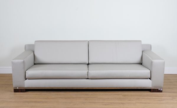 A LARGE GREY UPHOLSTERED FOUR SEAT SOFA