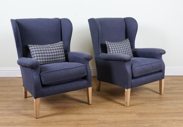 A PAIR OF BLUE UPHOLSTERED WINGBACK ARMCHAIRS (2)