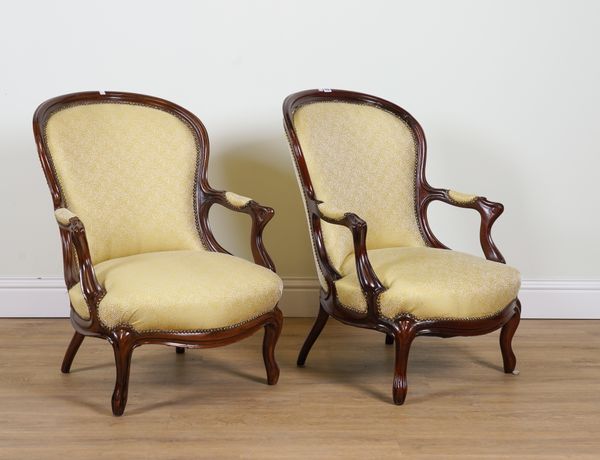 A PAIR OF 19TH CENTURY MAHOGANY FRAMED SPOON BACK OPEN ARMCHAIRS (2)