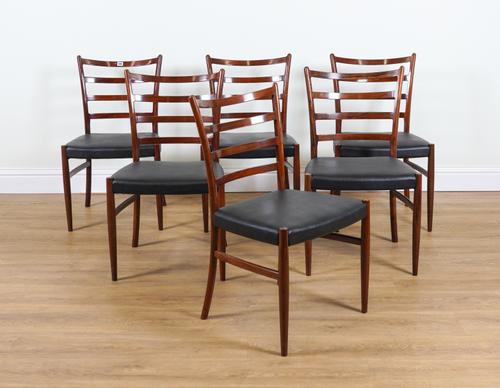 SCHOU ANDERSON; A SET OF SIX MID 20TH CENTURY ROSEWOOD LADDER BACK DINING CHAIRS
