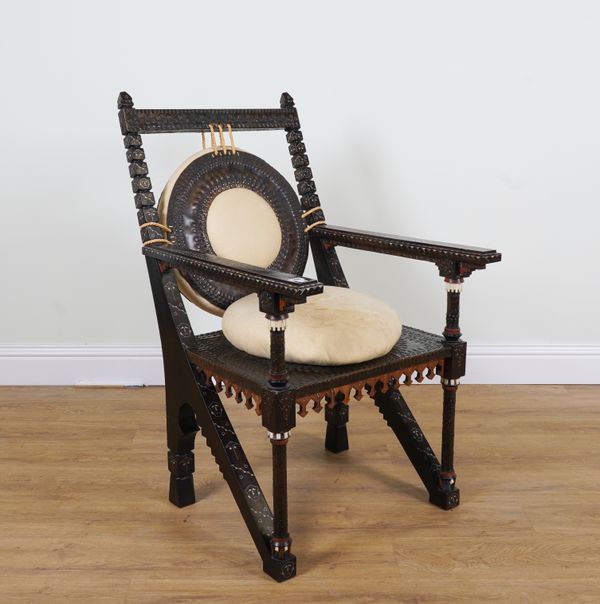 IN THE MANNER OF CARLO BUGATTI; A HARDWOOD AND METAL VENEERED BONE AND PEWTER INLAID OPEN ARMCHAIR