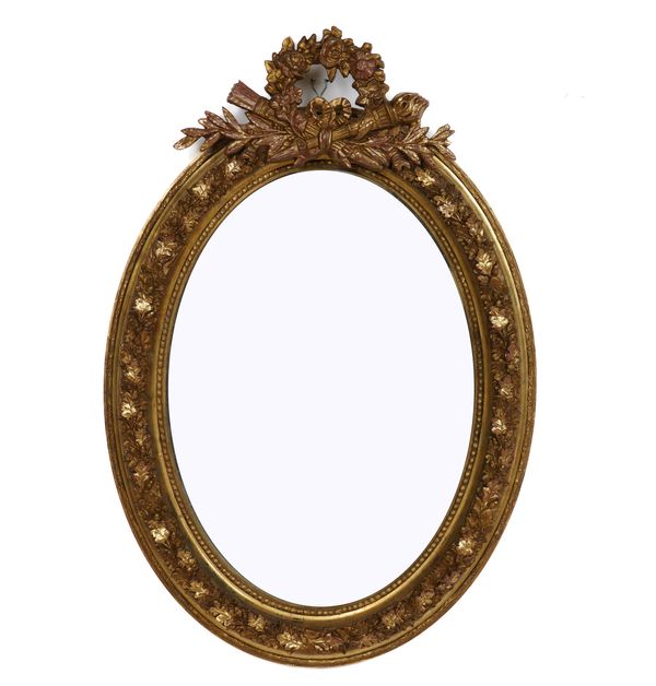 A VICTORIAN GILT FRAMED OVAL MIRROR