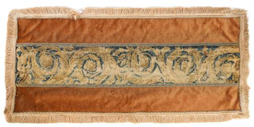 A FLEMISH VERDURE TAPESTRY FRAGMENT BANNER DEPICTING SCROLLING FOLIAGE
