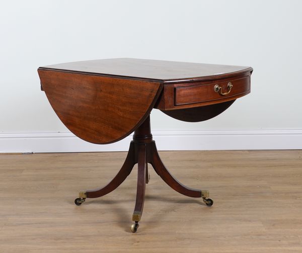 A REGENCY MAHOGANY DROP FLAP OVAL PEMBROKE TABLE