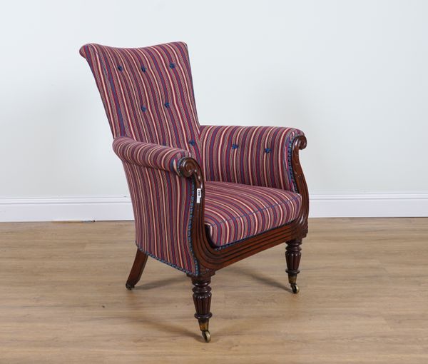 A GEORGE IV MAHOGANY FRAMED LIBRARY CHAIR