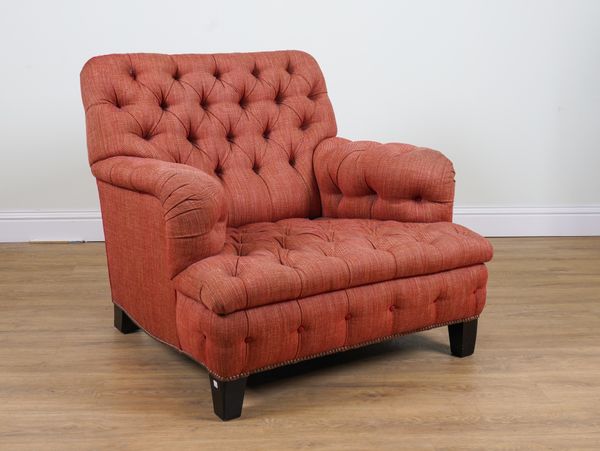 A LARGE SQUARE BACK EASY ARMCHAIR