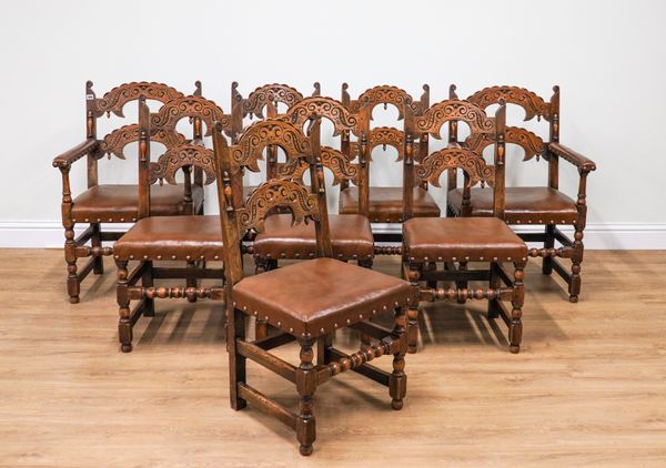 A SET OF TEN CHARLES II STYLE CARVED OAK DINING CHAIRS