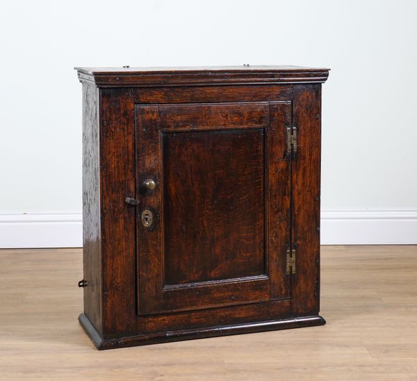 A 17TH CENTURY OAK HANGING CUPBOARD