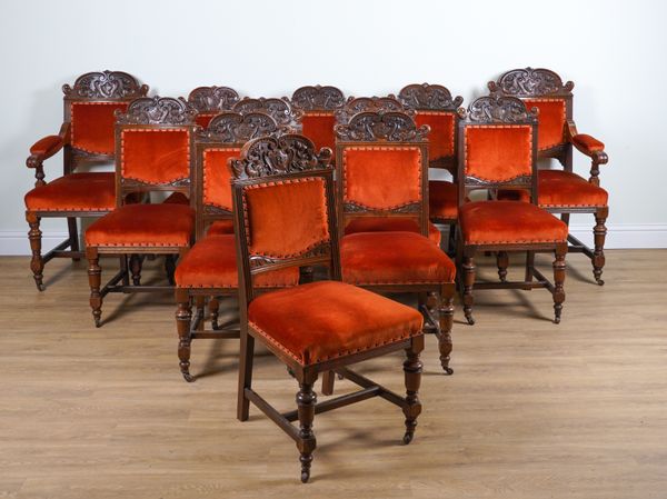 S.J.WARING AND SONS; A SET OF TWELVE 19TH CENTURY CARVED OAK DINING CHAIRS (12)