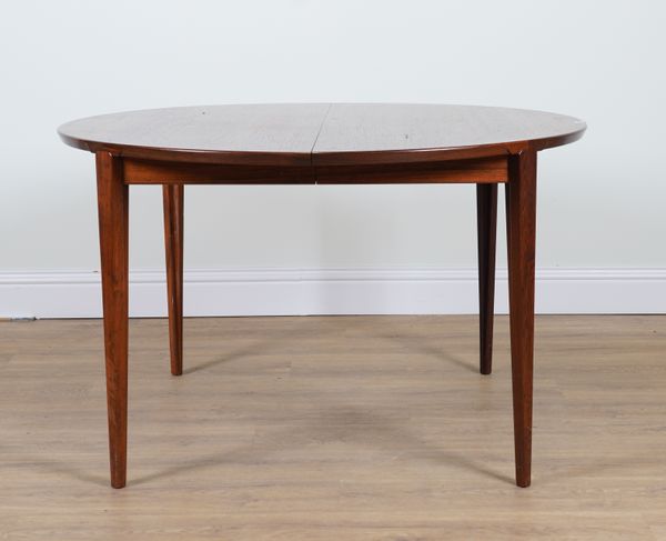 ROSENGREN HANSEN DESIGN FOR BRANDE MÖBELINDUSTRI ; A 20TH CENTURY ROSEWOOD CIRCULAR EXTENDING DINING TABLE