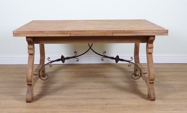 A SPANISH OAK PARQUET TOP DRAWER LEAF EXTENDING DINING TABLE