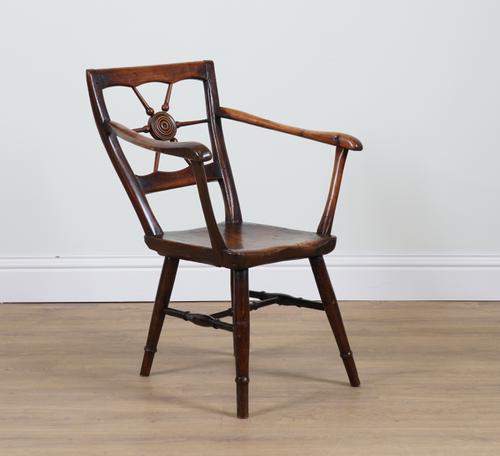 A 19TH CENTURY PRIMITIVE FRUITWOOD AND ELM BULLSEYE BACK OPEN ARMCHAIR