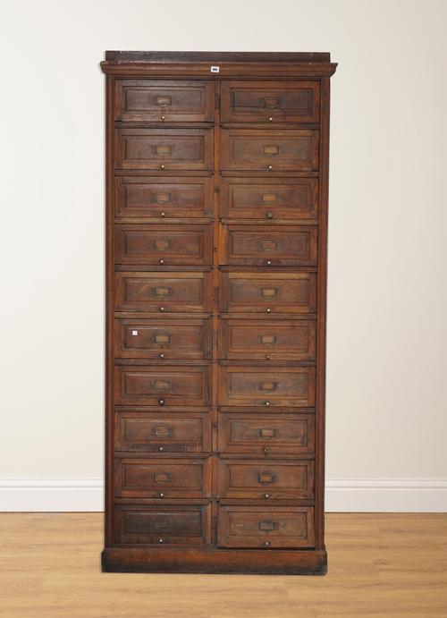 AN EARLY 20TH CENTURY OAK TWENTY DRAWER HABERDASHERY CABINET