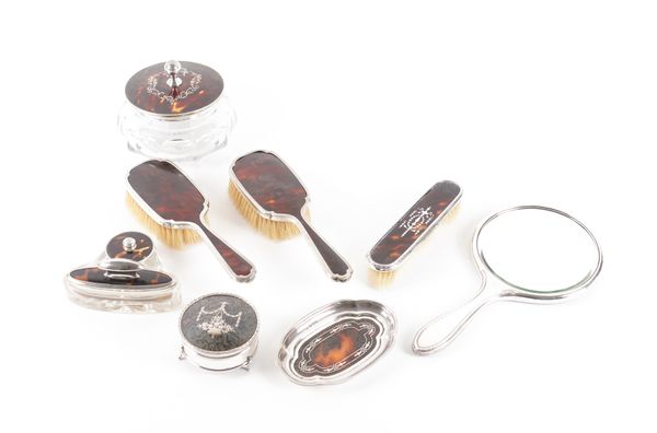 A COMPOSITE GROUP OF SILVER AND TORTOISESHELL MOUNTED DRESSING TABLE WARES (8)