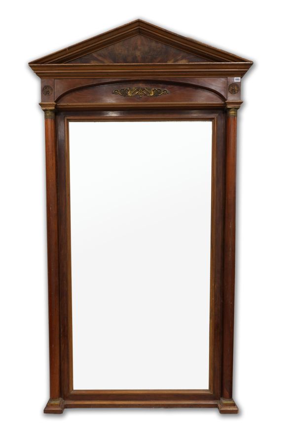 AN EMPIRE GILT METAL MOUNTED MAHOGANY MIRROR