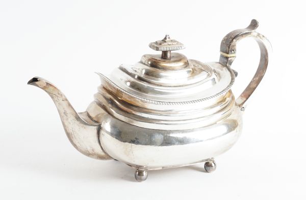 A GEORGE III SILVER TEAPOT