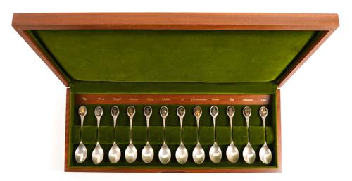A SET OF TWELVE SILVER SPOONS
